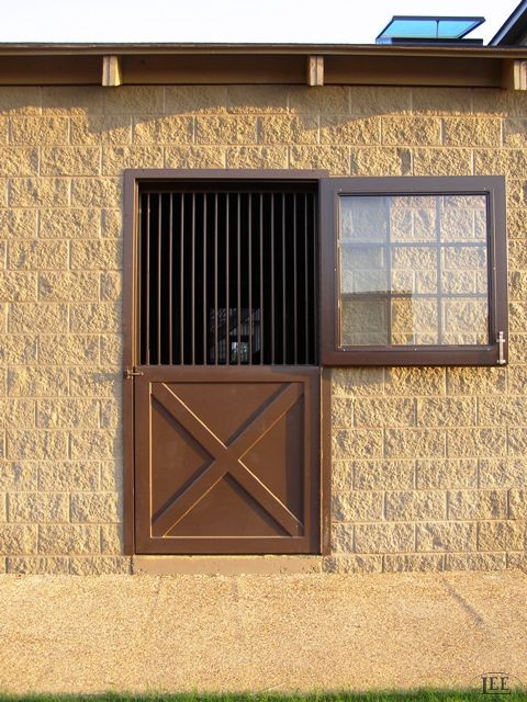 Although appearing as one solid piece when closed, Lucas Equine Equipment Dutch doors are actually split in two sections. 