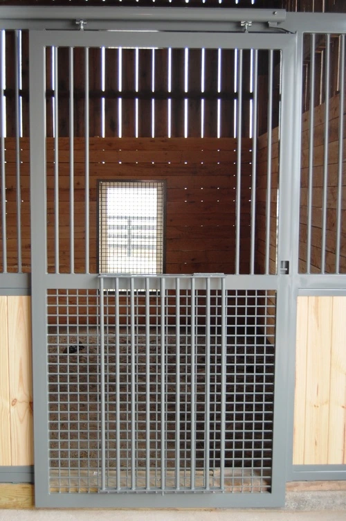 Upper stall fronts with maroon wood and wire mesh ventilation grills