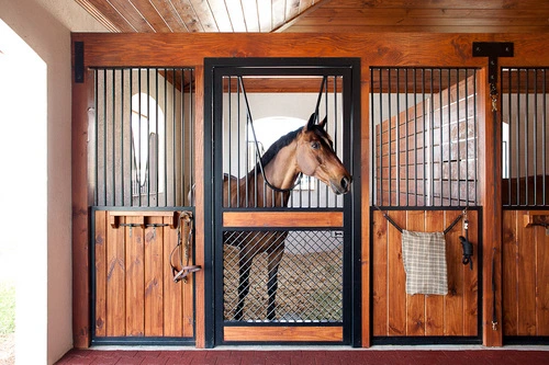 Dark mahogany three-bay stall front with decorative mesh and rope accents