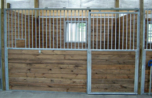 Close-up detail of galvanized corrugated metal and natural wood stall front panel