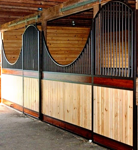 Natural pine and gray metal stall fronts with corrugated metal upper grills and decorative rope swags