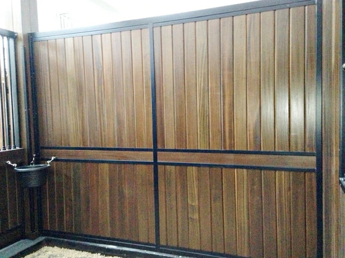 Galvanized corrugated metal stall wall panels with black metal frame and sliding door