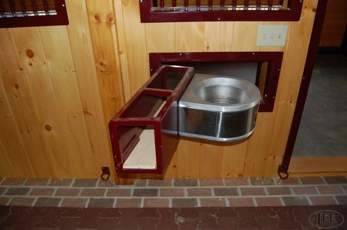 Black metal framed cabinet door with rich mahogany vertical wood panel insert