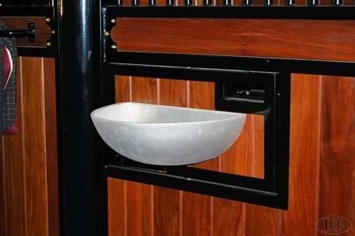 Open view of mahogany tack box with black metal frame displaying white ceramic bowl and metal hardware