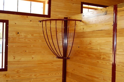 Dark mahogany vertical plank partition or room divider wall in natural pine ceiling barn interior