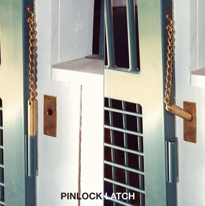 PIN/LOCK LATCH: White painted stall front with pin lock latch hardware, vertical bars and decorative chain hanging
